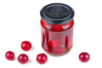 Cherry plums canned in glass jar isolated on white background