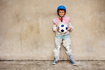 Child hold soccer ball overprotecting bubble wrap - obrazy, fototapety, plakaty