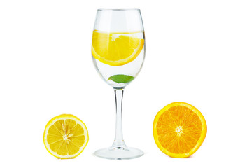 Wineglass with water (or alcohol), lemon slices and mint