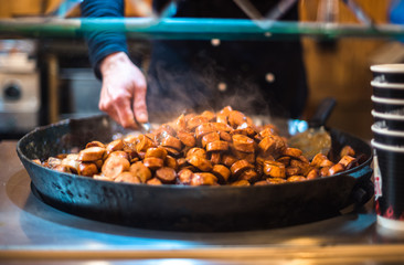 Christmas market uk manchester festival night winter holiday decoration people food weiner wurst delicious steam hot fried pan