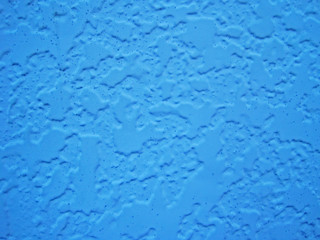  Close-up photo of a blue wall of a private house