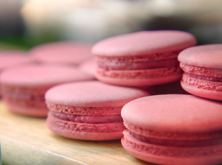 Selective Focus of French Strawberry Macaroons, Sweet Pink Almond Macarons or French sweet cookie. 