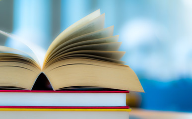 Open book lying on the table in the library