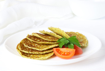 Vegetarian pancake with spinach, parsley and tomato