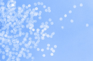 Flat lay paper round confetti on pastel blue background top view. Festive holiday background, concept of party, birthday, christmas or new year. Copyspace for text. Color of the year 2020 classic blue