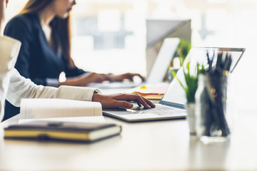 Close up of business woman working with notebook computor in the office. freelancer working online in the coffee shop.