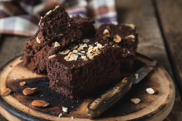 Homemade chocolate cake with almonds on the table