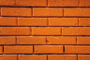 Brick wall made of orange or brown bricks background