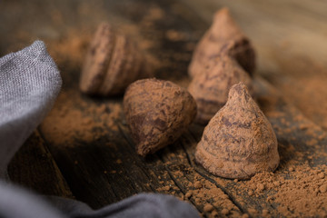Chocolate truffles on a wooden table