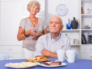 Elderly upset man having problems in relationship with spouse