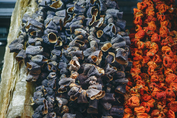 Traditional dry seasoning vegetables hang in a market in Istanbul in Turkey. Authentic food or seasoning on food