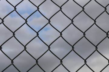 Fototapeta premium Metal Fence With Sky Chain Link Mesh