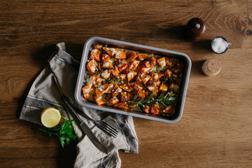 overlay healthy roasted butternut squash tahini vegan tray homemade on a wooden rustic table