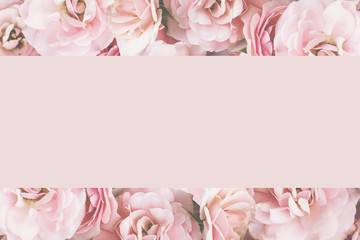 Styled feminine flat lay on pale pastel pink background of roses , top view. Minimal woman's desktop with blank page mock up, open envelope and pink flower, Creative concept, empty greeting card