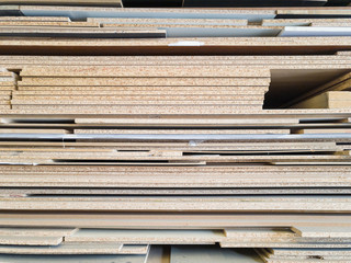 Stack of wood panel Particle board and MDF with different thicknesses and size, industrial wood, furniture industry.