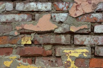 Old brick orange sprawled wall.