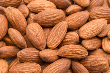 Fototapeta premium Close up peeled almond nut, almond background texture. healthy food and snack concept.