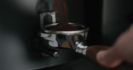 Grinding coffee into naked portafilter