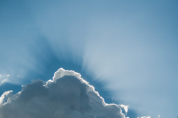 Sunbeam through the haze on blue sky