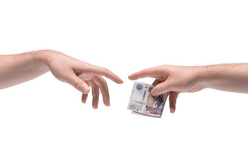 Two male hands passing one another money on white background