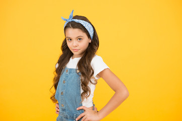 Summer outfit concept. Girl long curly hair. Fashion trend. Little fashionista. Happy childhood. Modern teen clothing. Accessory shop. Positive vibes. Cute small kid fashion girl. Fashion accessories