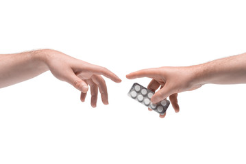 Two male hands passing one another pills package on white background