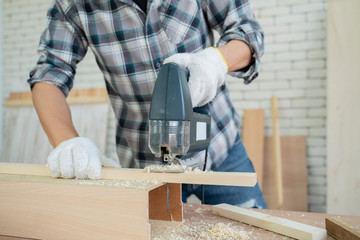 Carpentry is using electrical saws for work.