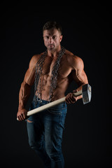 Brutality concept. Bodybuilder concept. Healthy and strong. Attractive guy muscular body. Bodybuilder brutal guy. Man fitness training with heavy hammer. Mining industry. Coal miner workshop