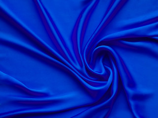 smooth elegant luxurious blue satin background texture close up - abstracted wallpaper