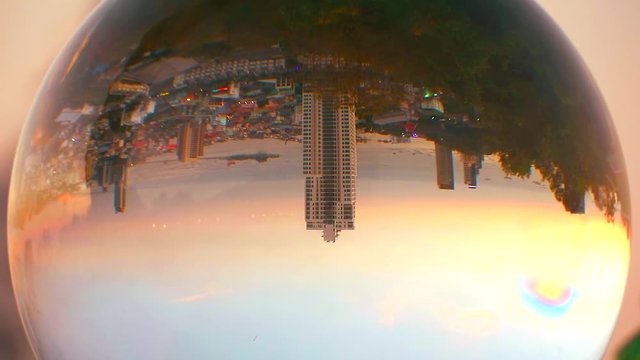 The city is upside down when the sunsets in a crystal ball