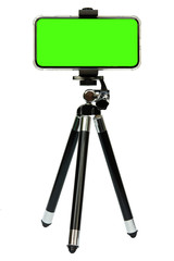 Smart phone of green screen on tripod isolated on white background with clipping path.