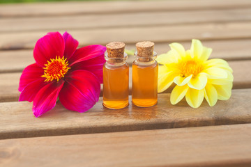 dahlia essential oil in  beautiful bottle on table