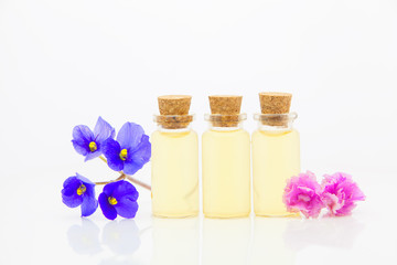violet essential oil in  beautiful bottle on White background