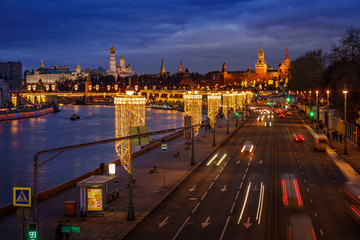 Obraz premium High and wide angle night winter view of the traffic light tails toward Moscow Kremlin, Russia. Travel destination Moscow, Russia