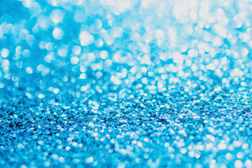 Defocused blue glitter background. blue abstract bokeh background. Christmas abstract background.