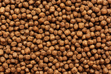 Background of dry pet food. The texture of cat and dog food.