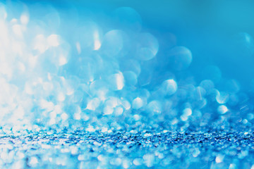 Defocused blue glitter background. blue abstract bokeh background. Christmas abstract background.