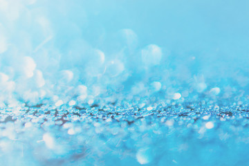 Defocused blue glitter background. blue abstract bokeh background. Christmas abstract background.