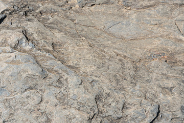 surface of the stone with grey, brown tint