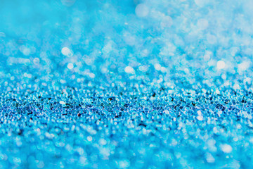 Defocused blue glitter background. blue abstract bokeh background. Christmas abstract background.