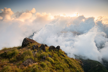 Clouds and mist floating in the mountain valley at sunset, Mulayit Taung, Moei Wadi, Myanmar
