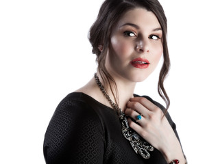 close up beauty face image of a female Caucasian model wearing elegant jewelry and red lipstick....