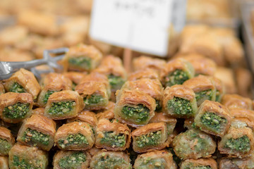 Baklava (modern Middle Eastern Arab-style dessert) baked with sugar and honey syrup, sweet and stuffed with almonds, nuts, chocolate or pistachios. In the old market, Jerusalem.