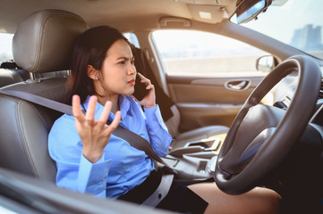 businesswoman, work, driving, multitasking, car, lifestyle concept. Businesswoman multitasking while driving car working and talking on cell phone on the road.