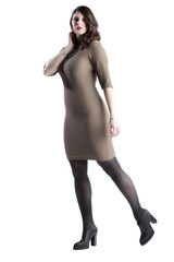 Fototapeta premium beautiful female fashion model wearing a stylish glamour dress is posing in various positions in the photo studio. white background in isolated space. elegant lifestyle with luxury appeal 