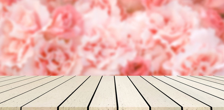 abstract blurred group of freshness blossom pink roses flowers  background with luxury marble counter top perspective for summer and spring season to show  and promote product on display image