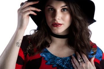 close up beauty face image of a female Caucasian model wearing elegant jewelry and red lipstick....