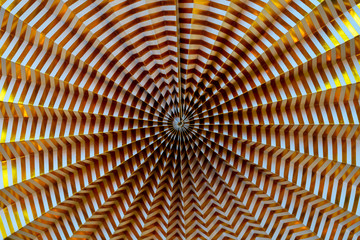 Abstract golden background. Lines from the center. Corrugated paper background.