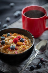 Breakfast porridge topped with blueberries and almonds