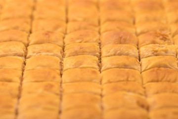 Baklava (modern Middle Eastern Arab-style dessert) baked with sugar and honey syrup, sweet and stuffed with almonds, nuts, chocolate or pistachios. In the old market, Jerusalem.